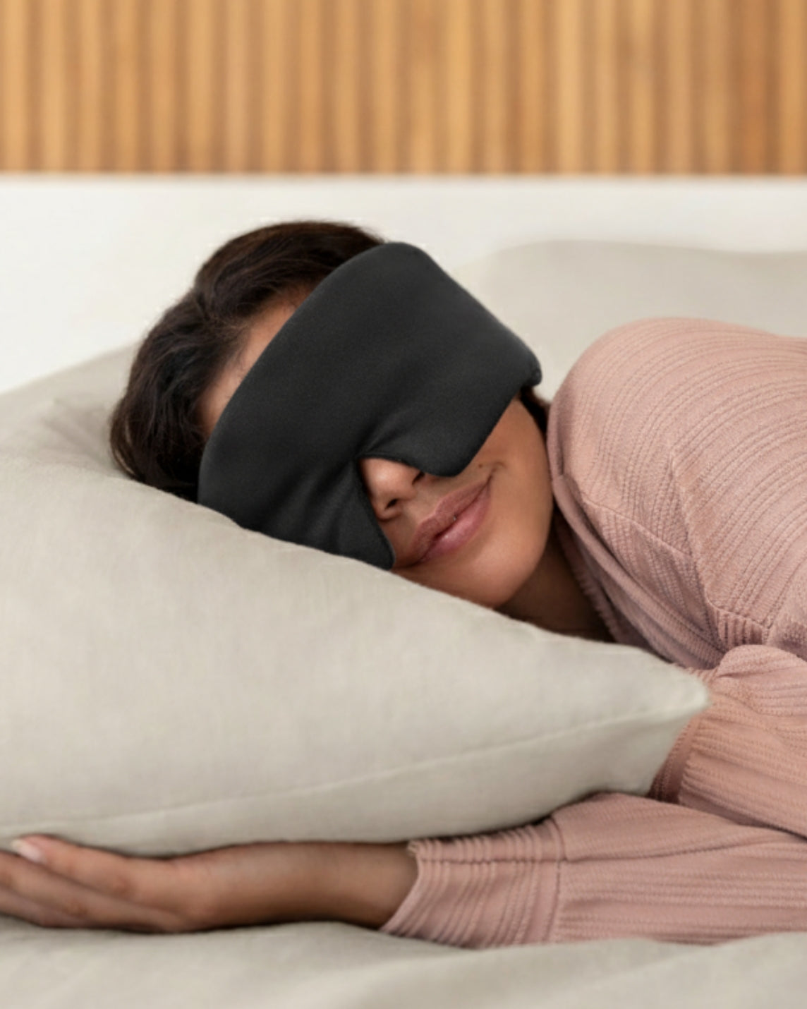 Woman sleeping with a black silk sleep mask [47849099002075]
