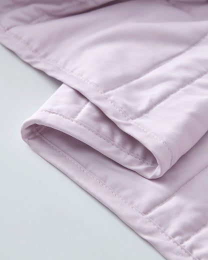 Folds of cotton fabric of a lavender weighted blanket [47867972059355]