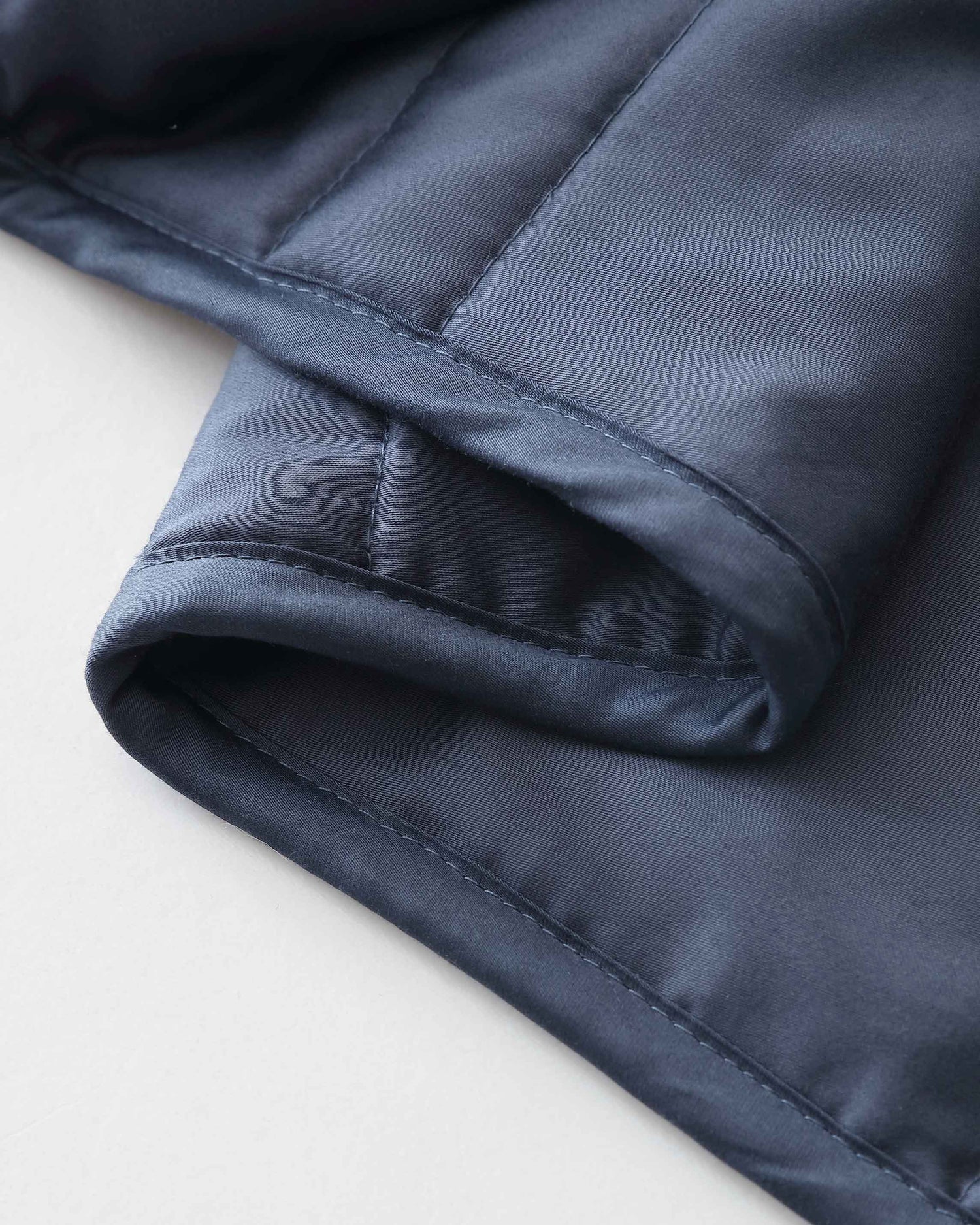 A close up view of the blue weighted blanket [43649942782171, 45574417875163, 44422804340955, 45574418137307, 44422811287771, 46452818510043, 44422816432347, 46452819067099, 47185819762907, 47185819992283, 47185820025051, 47185820123355, 46301293543643, 46301293773019, 46301293805787, 46301293904091]