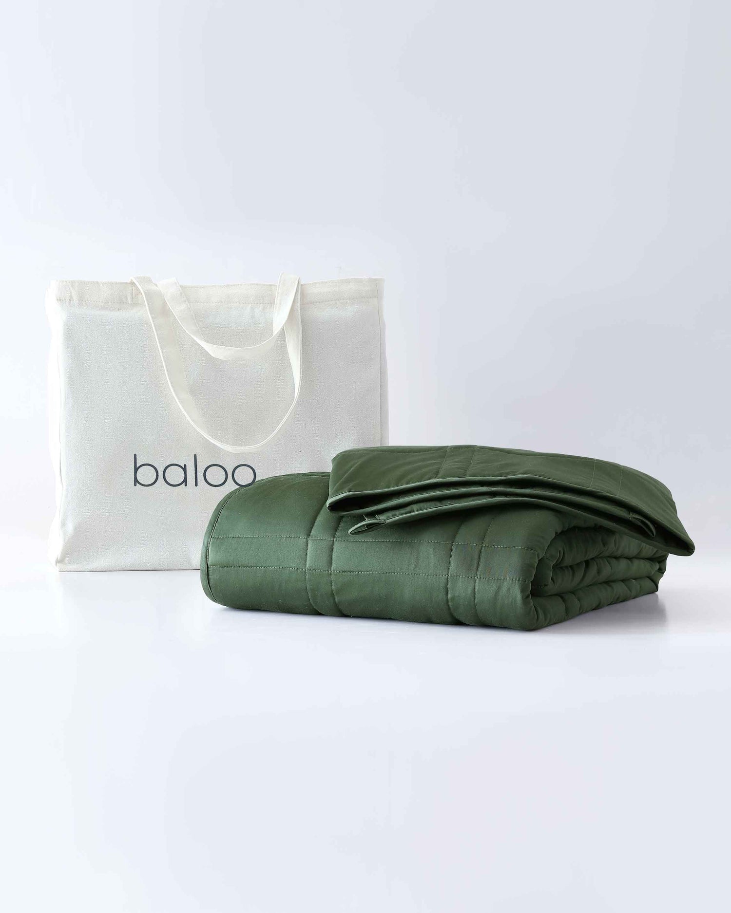 folded weighted blanket in spruce green against an empty background [44422820561115, 45574418333915, 44422814826715, 46452818542811, 44422813090011, 46452818575579, 44422818234587, 46452819099867,46061921730779, 46061921763547, 46061921796315, 46063267709147, 46063269118171, 47185820057819, 47185820090587, 47185820156123, 47185820188891]