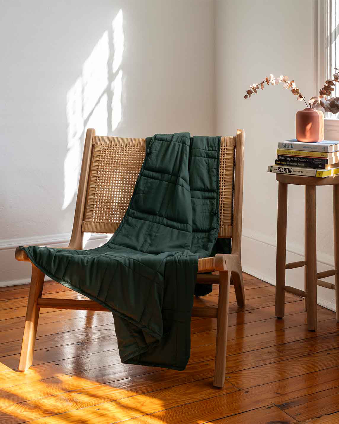 Weighted blanket in spruce green thrown across a chair [44422820561115, 45574418333915, 46684279668955, 47185820188891]